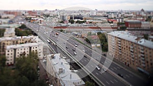 Aerial view on heavy traffic closeup , vehicles motion blur on viaduct. Day road city motion blur. Aerial view of