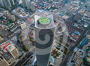 Aerial view of helipad. Helicopter landing pad on rooftop on skyscraper, high-rise office building in Shanghai Downtown, China.