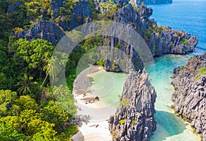 Aerial view of Hidden beach in Matinloc Island, El Nido, Palawan, Philippines - Tour C route - Paradise lagoon and beach in