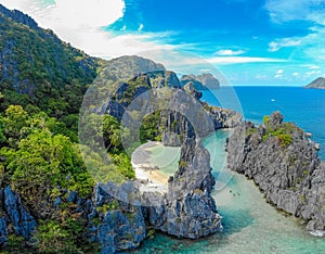 Aerial view of Hidden beach in Matinloc Island, El Nido, Palawan, Philippines - Tour C route - Paradise lagoon and beach in