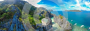 Aerial view of Hidden beach in Matinloc Island, El Nido, Palawan, Philippines - Tour C route - Paradise lagoon and beach in
