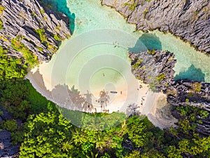 Aerial view of Hidden beach in Matinloc Island, El Nido, Palawan, Philippines - Tour C route - Paradise lagoon and beach in