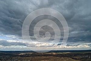 Aerial view from high altitude of earth covered with puffy rainy clouds forming before rainstorm