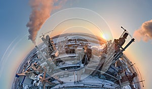 Aerial view from high altitude of little planet earth with cement factory high concrete structure and tower crane at