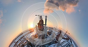 Aerial view from high altitude of little planet earth with cement factory tower with high concrete plant structure at