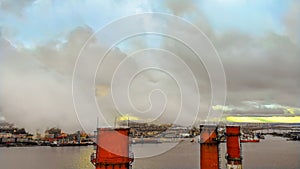 Aerial view of high chimney pipes with grey smoke. Chimneys Plant at Sunset. Air Pollution Concept.