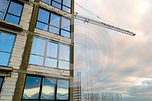 Aerial view of high residential apartment building under construction. Real estate development