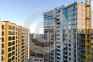 Aerial view of high residential apartment building under construction. Real estate development