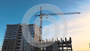 Aerial view of high residential apartment building under construction. Real estate development.