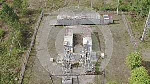 Aerial view high voltage transformer equipment at the electrical power substation. High-voltage circuit breaker. High