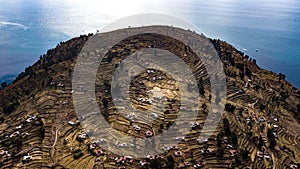 Aerial view on the highest point of terraced slopes of Taquile island