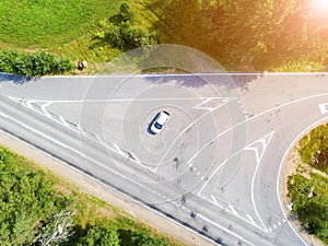 Aerial view of highway. Aerial view of a country road with moving car. Car passing by. Aerial road. Aerial view flying. Captured f