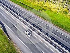 Aerial view of highway in city. Cars crossing interchange overpass. Highway interchange with traffic. Aerial bird`s eye photo of h