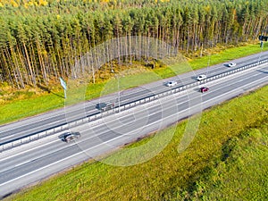 Aerial view of highway in city. Cars crossing interchange overpass. Highway interchange with traffic. Aerial bird`s eye photo of h