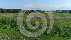 Aerial view Highway through green fields