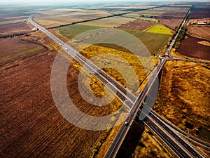 Aerial view of highway interchange of a small city in open space
