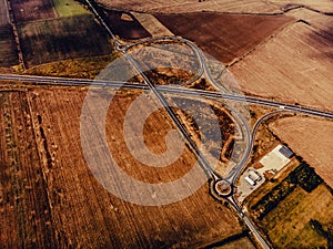 Aerial view of highway interchange of a small city in open space