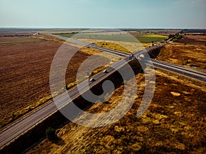 Aerial view of highway interchange of a small city in open space