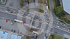 In an aerial view of a highway jam during rush hour, cars are slow to move on highway due to heavy traffic jams