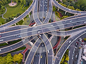 Aerial view of highway junctions shape letter x cross. Bridges, roads, or streets with trees in transportation concept. Structure