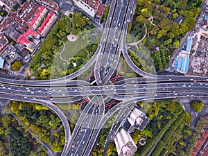 Aerial view of highway junctions shape letter x cross. Bridges, roads, or streets with trees in transportation concept. Structure