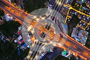 Aerial view of highway junctions Top view of Urban city, Bangkok at night, Thailand photo