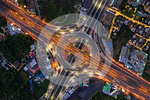 Aerial view of highway junctions Top view of Urban city, Bangkok at night, Thailand