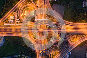 Aerial view of highway junctions Top view of Urban city, Bangkok at night, Thailand