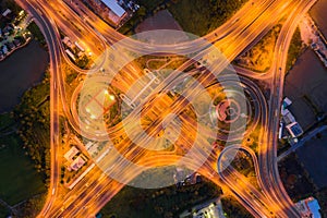 Aerial view of highway junctions Top view of Urban city, Bangkok at night, Thailand