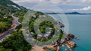 Aerial view of highway and luxury resort villas with pools on rocks near ocean in Thailand.Koh Samui. Landscape.Asia. Drone.