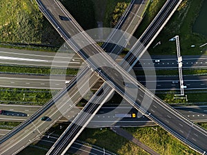 Aerial view of a highway with numerous roads and vehicles navigating their way