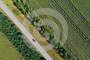 Aerial view of a highway passing through green fields