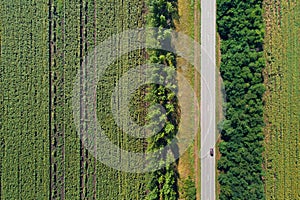 Aerial view of a highway passing through green fields