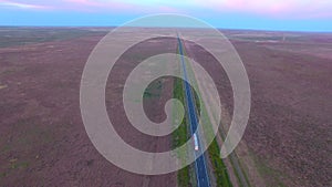 Aerial view highway road on dusk semi-trailer