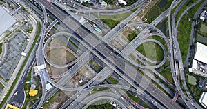 Aerial View of Highway Road Interchange with Busy Urban Traffic Speeding on Road