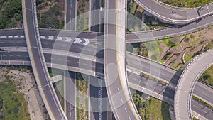 Aerial view of highway road, interchange and overpass in city.