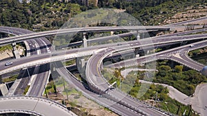 Aerial view of highway road, interchange and overpass in city.