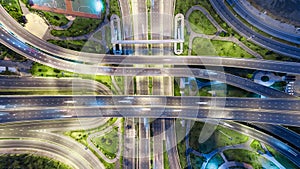 Aerial view highway road intersection at dusk for transportation, distribution or traffic background