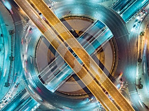 Aerial view highway road intersection at night for transportation, distribution or traffic background