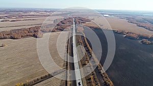 Aerial view on the highway on a sunny day. Cargo transportation, logistics, cargo delivery. Autobahn. Road passing