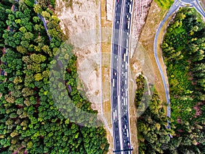 Aerial view of highway, traffic jam, green forest, Netherlands