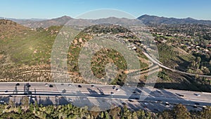 Aerial view of highway with traffic surrounded by houses, Interstate 15 with in vehicle movement.