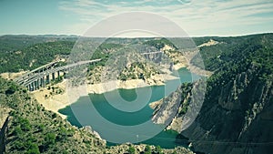Aerial view of higway and railway bridges in mountainous area of Spain