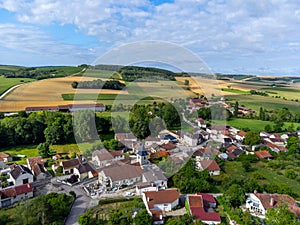 Aerial view on hilly vineyards and village Urville, champagne vineyards in Cote des Bar, Aube, south of Champange, France