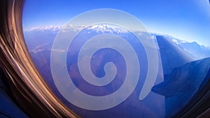 Aerial view of Himalayas from airplane window on clear day