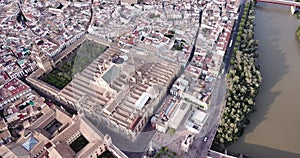 Aerial view of Historic centre of Cordoba with antique Roman Bridge over Guadalquivir river and medieval Mosque