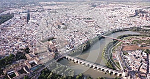 Aerial view of Historic centre of Cordoba with antique Roman Bridge over Guadalquivir river and medieval Mosque