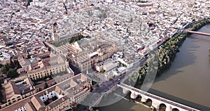 Aerial view of Historic centre of Cordoba with antique Roman Bridge over Guadalquivir river and medieval Mosque