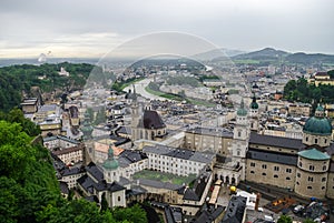 Aerial view of the historic city of Salzburg at fog and cloudy w