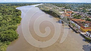 Aerial view of the historic town Santa Cruz de Mompox and river in sunlight, Colombia, World Heritage